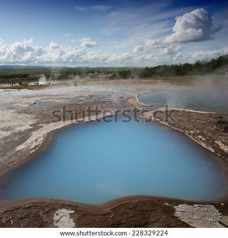 Geothermal activity near Geysir in Iceland. Colorful soil and steaming hot springs. Travel destination. Square composition.