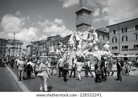 ROME, ITALY - MAY 13, 2010: Tourists visit Piazza Navona in Rome, Italy. Rome is the 3rd most visited city in Europe (5.5m international tourist arrivals 2009).