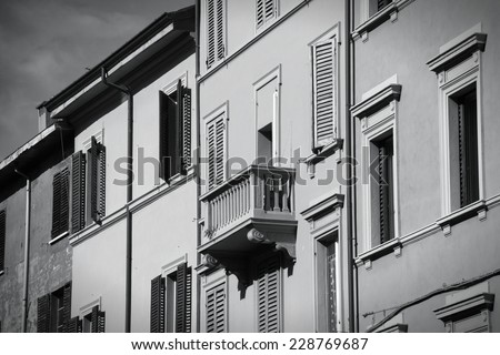 Bologna, Italy. Row of townhouses. Old architecture. Black and white tone - retro monochrome BW color style.