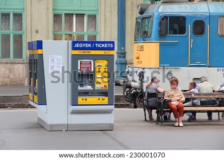 BUDAPEST, HUNGARY - JUNE 19, 2014: Travelers wait at Nyugati Railway Station in Budapest. It is the western train station and was opened in 1877.