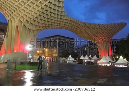 SEVILLE, SPAIN - NOVEMBER 3, 2012: People visit Metropol Parasol in Seville, Spain. Metropol Parasol claims to be the largest wooden structure in the world.