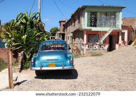 TRINIDAD, CUBA - FEBRUARY 6, 2011: Oldtimer American car parked in the street in Trinidad. Cuba has one of the lowest car-per-capita rates (38 per 1000 people in 2008).