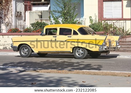 SANCTI SPIRITUS, CUBA - FEBRUARY 6, 2011: Oldtimer American car parked in the street in Sancti Spiritus. Cuba has one of the lowest car-per-capita rates (38 per 1000 people in 2008).