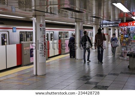 TOKYO, JAPAN - APRIL 13, 2012: People exit Tokyo Metro. With more than 3.1 billion annual passenger rides, Tokyo subway system is the busiest worldwide.