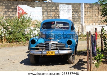 BARACOA, CUBA - FEBRUARY 12, 2011: Oldtimer car in Baracoa, Cuba. Cuba has one of the lowest car-per-capita rates (38 per 1000 people in 2008).