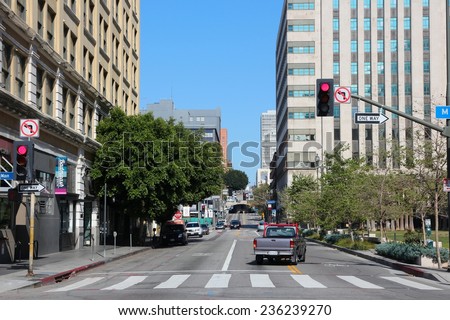 LOS ANGELES, USA - APRIL 5, 2014: People drive cars in downtown LA. Los Angeles is the 2nd most populous city in the USA (3,792,621 people).
