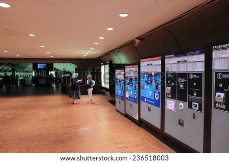 WASHINGTON, USA - JUNE 14, 2013: People walk into metro station in Washington. With 212 million annual rides in 2012 Washington Metro is the 3rd busiest rapid transit system in the USA.