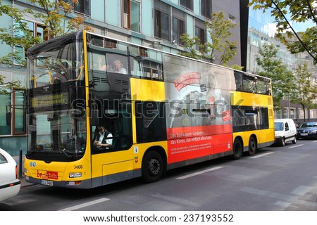 BERLIN, GERMANY - AUGUST 27, 2014: People ride a Man city bus in Berlin. Public transport company BVG operates 149 daytime bus routes with 2634 stops.