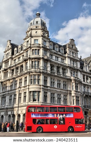 LONDON, UK - MAY 14, 2012: People ride London Bus in London. As of 2012, LB serves 19,000 bus stops with a fleet of 8000 buses. On a weekday 6 million rides are served.