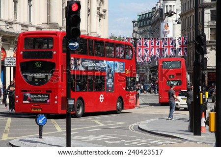LONDON, UK - MAY 13, 2012: People ride London Bus in London. As of 2012, LB serves 19,000 bus stops with a fleet of 8000 buses. On a weekday 6 million rides are served.