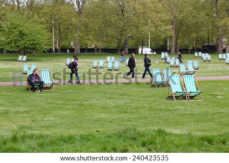 LONDON, UK - MAY 16, 2012: People walk in St. James\'s Park in London. With more than 14 million international arrivals in 2009, London is the most visited city in the world (Euromonitor).