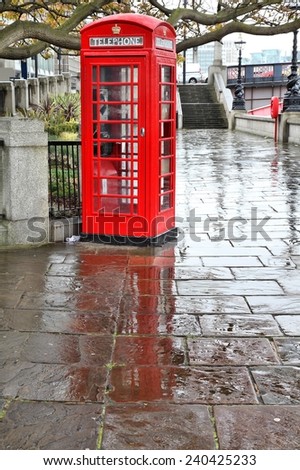 London, UK - red telephone box in the rain. HDR image.