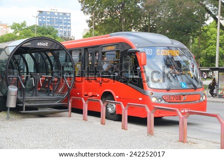 CURITIBA, BRAZIL - OCTOBER 7, 2014: People ride city bus in Curitiba, Brazil. Curitiba\'s bus system is world famous for its efficiency. Founded in 1974, it serves 2.3 million daily rides.