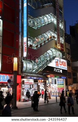 TOKYO, JAPAN - APRIL 12, 2012: People visit Akihabara shopping area in Tokyo. Stores in Akihabara are considered one of best electronics shopping destination in the world (TripAdvisor).