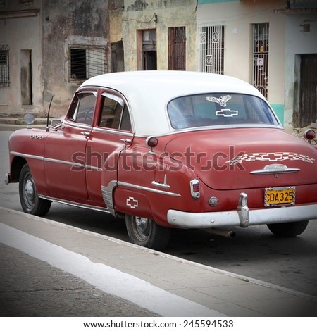 CAMAGUEY, CUBA - FEBRUARY 17, 2011: Classic American Chevrolet car parked in the street in Camaguey. Cuba has one of the lowest car-per-capita rates (38 per 1000 people in 2008).