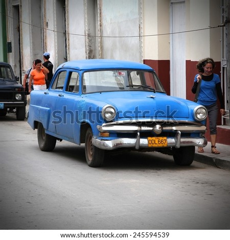 CAMAGUEY, CUBA - FEBRUARY 16, 2011: Classic American car parked in the street in Camaguey.  Cuba has one of the lowest car-per-capita rates (38 per 1000 people in 2008).
