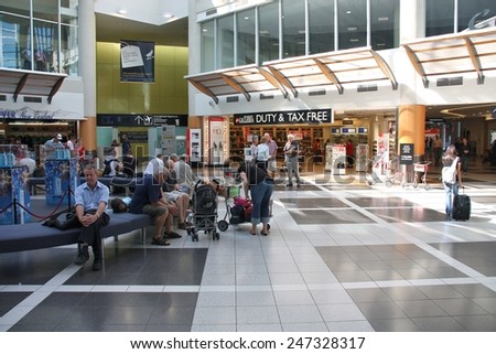 CHRISTCHURCH, NEW ZEALAND - MARCH 18, 2009: People wait at Christchurch Airport in New Zealand. The airport serves 5,709,272 annual passengers (2013).