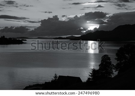 Norway landscape with sunset - Hogsfjorden in region Rogaland. Fjord reflection. Black and white tone - retro monochrome color style.