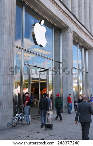 HAMBURG, GERMANY - AUGUST 28, 2014: People visit Apple Store in Hamburg. Since November 2014 Apple Inc is the largest publicly traded company in the world by market capitalization.