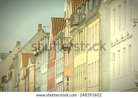 Copenhagen, Denmark. Architecture of Nyhavn. Cross processed color tone - retro style filtered image.