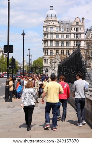 LONDON, UK - MAY 13, 2012: People visit Westminster, London. With more than 8.4 million people, London is the most populous municipality of the EU.