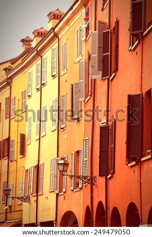 Modena, Italy. Colorful Mediterranean architecture. Cross processed color tone - retro image filtered style.