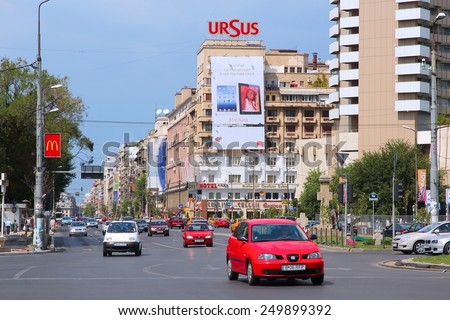 BUCHAREST, ROMANIA - AUGUST 19, 2012: People drive in Bucharest, Romania. With 235 vehicles per 1000 people Romania is the 63rd country by car ownership rate.