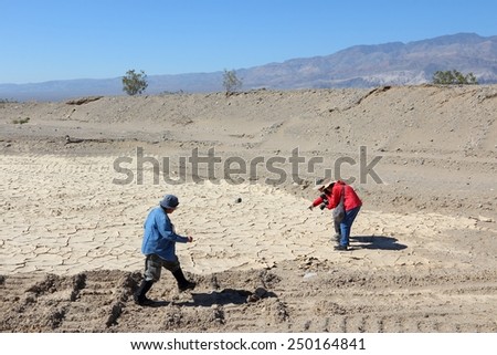 DEATH VALLEY, USA - APRIL 13, 2014: People take photos in Death Valley, California. Death Valley National Park was visited by 951 thousand people in 2013.