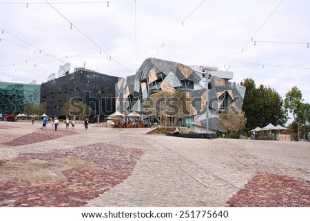 MELBOURNE, AUSTRALIA - FEBRUARY 8, 2009: People visit Federation Square in Melbourne. The square is a public space created in 2002 in the heart of Melbourne.