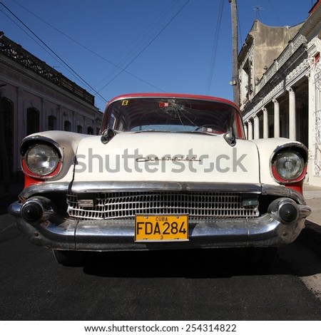 CIENFUEGOS, CUBA - FEBRUARY 3, 2011: Classic American Chevrolet car parked in the street in Cienfuegos, Cuba. Cuba has one of the lowest car-per-capita rates (38 per 1000 people in 2008).