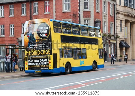 MANCHESTER, UK - APRIL 23, 2013: People ride JPT city bus in Manchester, UK. Former JPT is now Stagecoach Manchester, company with fleet of 877 buses (2014).
