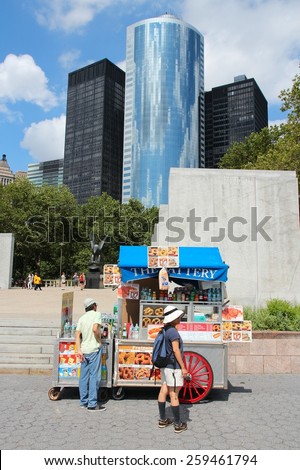 NEW YORK, USA - JULY 4, 2013: People buy pretzels Battery Park in New York. Almost 19 million people live in New York City metropolitan area.