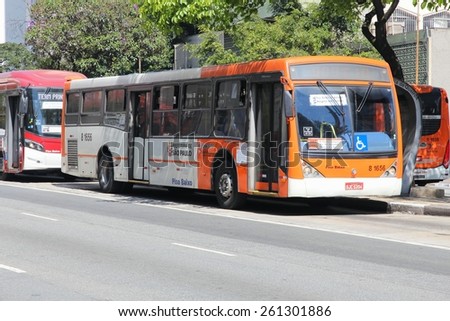 SAO PAULO, BRAZIL - OCTOBER 6, 2014: People ride a bus in Sao Paulo. There are some 17,000 buses in Sao Paulo.