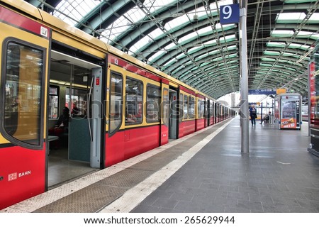 BERLIN, GERMANY - AUGUST 26, 2014: People wait at Ostbahnhof railway station in Berlin. The station dates back to 1842 and is one of 11 stations in Berlin that have long distance connections.