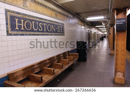 NEW YORK, USA - JULY 2, 2013: People exit Houston Street subway station in New York. With 1.67 billion annual rides, New York City Subway is the 7th busiest metro system in the world.
