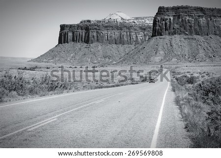 Road in United States - rural road in Utah leading to Canyonlands. Black and white tone - retro monochrome color style.