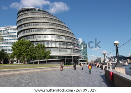 LONDON, UK - MAY 16, 2012: People walk next to the City Hall (GLA) in London. With more than 14 million international arrivals in 2009, London is the most visited city in the world (Euromonitor).