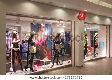 YOKOHAMA, JAPAN - MAY 10, 2012: H&M store window display in Yokohama, Japan. H&M was founded in 1947, it employs 87,000 people.