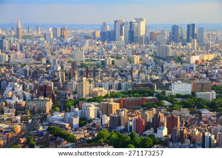 Tokyo skyline - urban sprawl cityscape with Toshima and Shinjuku wards. Warm sunset light.
