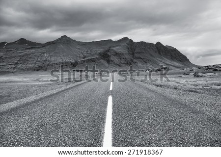 Ring Road in Iceland. Rainy weather mountain landscape. Black and white toned image.