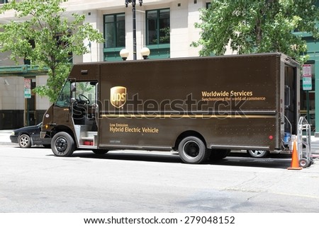 WASHINGTON, USA - JUNE 14, 2013: UPS low emissions hybrid electric delivery truck in Washington DC. UPS is one of largest package delivery companies worldwide with 397,100 employees.