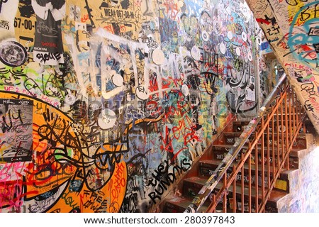 BERLIN, GERMANY - AUGUST 27, 2014: Urban art culture of old Hackesche Hofe in Berlin. The art nouveau architecture complex dates back to 1906 and part of it is covered in notable urban art.