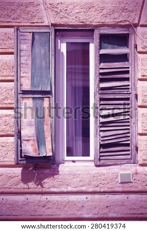 Rome, Italy - architectural feature in Trastevere district, old window. Cross processed color style - retro image filtered tone.