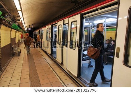 BARCELONA, SPAIN - NOVEMBER 6, 2012: People ride Metro train in Barcelona, Spain. Barcelona has the 2nd busiest subway system in Spain with 448m annual rides (2012).
