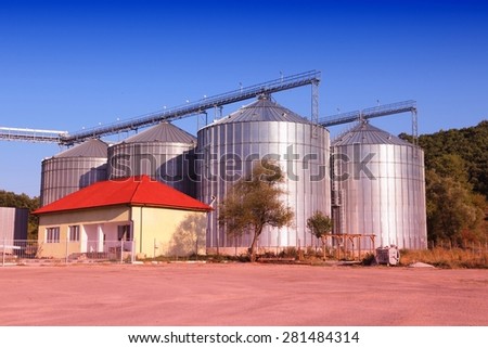 Steel grain silos - agriculture infrastructure in Bulgaria. Retro tone color effect - filtered colors style.