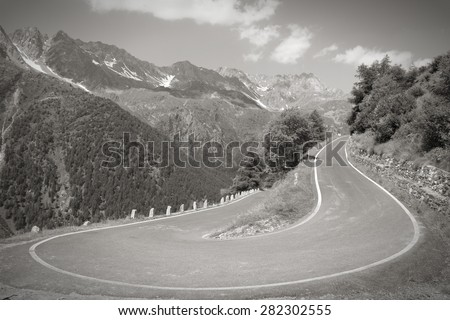 Italy, Stelvio National Park. Road to Gavia Pass in Ortler Alps. Black and white tone.