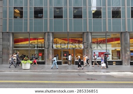 NEW YORK, USA - JULY 1, 2013: People walk by Wells Fargo Bank branch on in New York. Wells Fargo was the 23rd largest company in the United States in 2011 (by revenues).