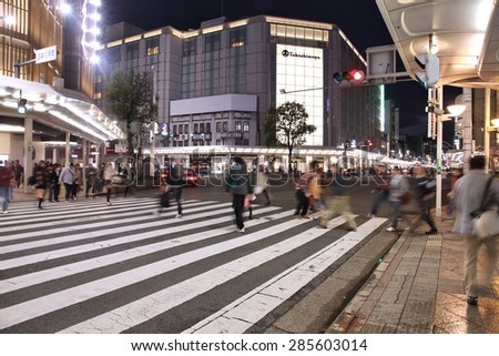 KYOTO, JAPAN - APRIL 16, 2012: Visitors shop at Shijo Street in Kyoto. With famous Marui and Takashimaya department stores Shijo is the best shopping area in Kyoto (according to Japan Guide).