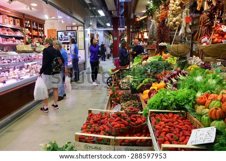 FLORENCE, ITALY - APRIL 30, 2015: People shop at Mercato Centrale market in Florence, Italy. The market is an ultimate Italian shopping experience. It was opened in 1874.