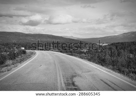 Scenic road in Norway, Oppland county. Black and white vintage style.